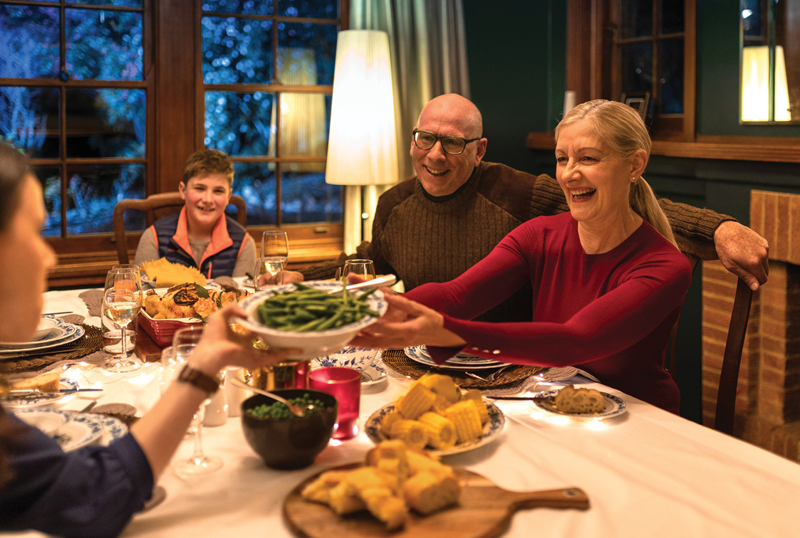 actewagl tesla powerwall solar power campaign - family having dinner on a winder night